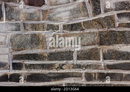 Background from marble and granite stones laid out in masonry Stock Photo