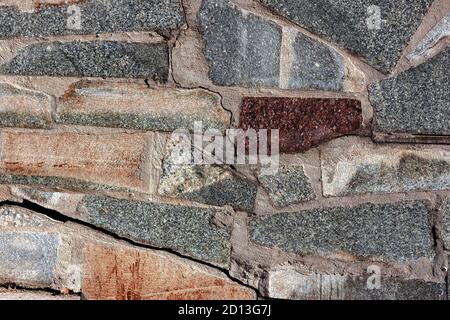 Background from marble and granite stones laid out in masonry Stock Photo