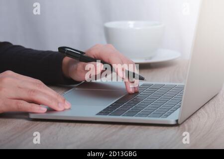 Cropped image of male hands working on computer. Stock Photo