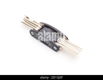 bike multifunctional tool on white background, isolate. Hexagon, screwdriver and socket concept in one tool Stock Photo