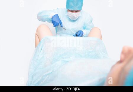 A woman at a gynecologist's appointment installs a contraceptive coil on the uterus as a method of contraception against unwanted pregnancy. Preventiv Stock Photo