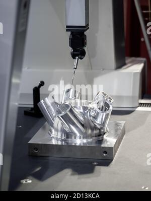 CMM Coordinate Measuring Machine measuring on workpiece. Industrial manufacturing Stock Photo