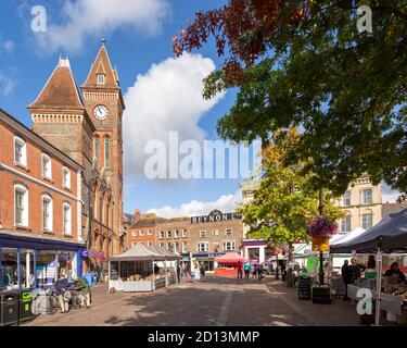 Clock tower of town hall and historic buildings in Market Place, Newbury, Berkshire, England, UK Stock Photo