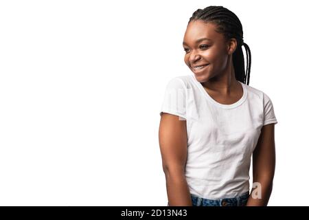 African Woman With Brackets Posing Looking Aside Over White Background Stock Photo