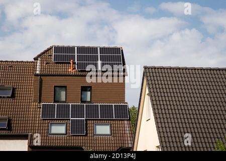 rooftop solar power plant on a residential house in the district Niehl, Cologne, Germany.  Photovoltaikanlage auf dem Dach eines Wohnhauses im Stadtte Stock Photo