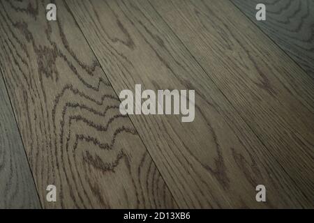 Vintage wooden parquet background. Top view of wooden texture. Herringbone, chevron flooring pattern. Stock Photo