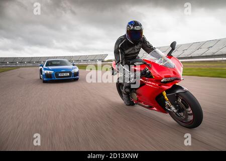 Audi R8 and Ducati Superbike 1299 Panigale during a photoshoot at Rockingham Motor Speedway, 12st June 2016 Stock Photo