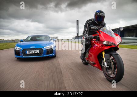 Audi R8 and Ducati Superbike 1299 Panigale during a photoshoot at Rockingham Motor Speedway, 12st June 2016 Stock Photo