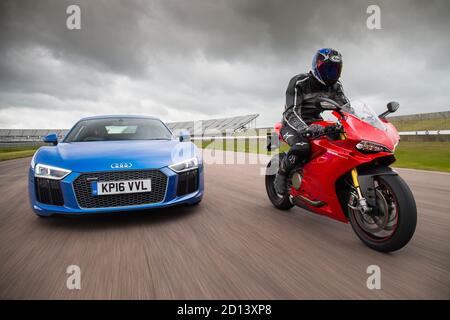 Audi R8 and Ducati Superbike 1299 Panigale during a photoshoot at Rockingham Motor Speedway, 12st June 2016 Stock Photo