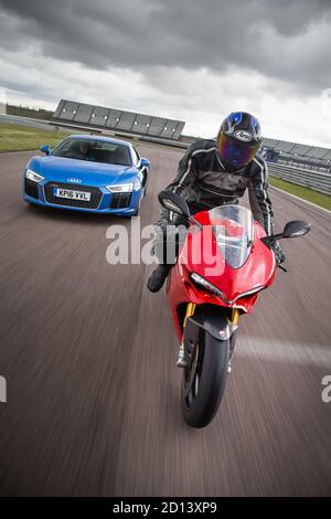 Audi R8 and Ducati Superbike 1299 Panigale during a photoshoot at Rockingham Motor Speedway, 12st June 2016 Stock Photo