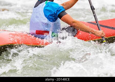 engaged athlete downhill with canoe Stock Photo