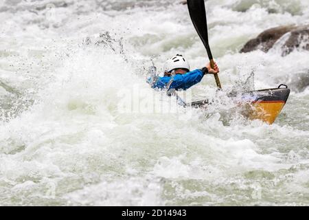 engaged athlete downhill with canoe Stock Photo