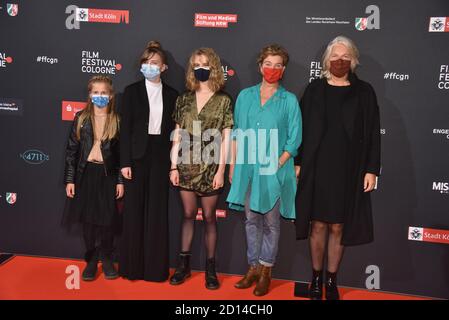 Cologne, Germany. 03rd Oct, 2020. Actress Felizia Trube, l-r, Momo Beier, Stella Holzapfel and Margarita Broich and director Petra Seeger come with mask to the screening of the film 'VATERSLAND' at the Film Festival Cologne. Credit: Horst Galuschka/dpa/Alamy Live News Stock Photo