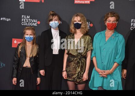 Cologne, Germany. 03rd Oct, 2020. Actress Felizia Trube, l-r, Momo Beier, Stella Holzapfel and Margarita Broich come with mask to the screening of the film 'VATERSLAND' at the Film Festival Cologne. Credit: Horst Galuschka/dpa/Alamy Live News Stock Photo
