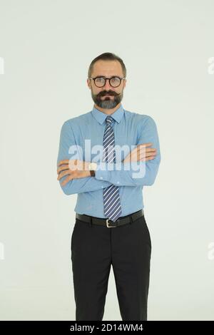 Portrait of  handsome Caucasian man feeling happy and smiling, wearing watch and necktie Stock Photo