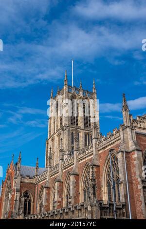 Hull Minster church tower with clock with a blue sky background on a sunny day. Stock Photo