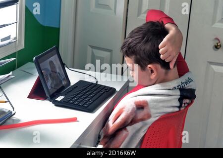 Difficult task, 4nd grade student during distance learning class, Washington state, USA, Stock Photo