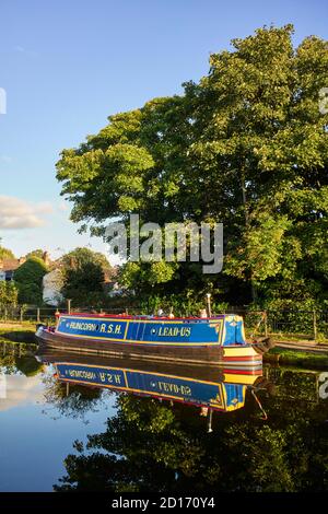 Attractively painted narrowboat Lead-Us moored at Lymm on the Bridgewater canal Stock Photo