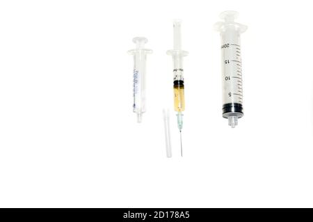 Three syringes. Looking for the vaccine against Covid-19.All united, side by side against the pandemic. Stock Photo
