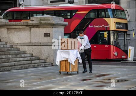 Fortnum & Mason outdoors restaurant is set up outside the Royal Exchange as the coronavirus pandemic continues to keep city workers away, London. Stock Photo