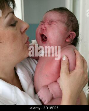 Baby girl Nadia, who weighed 7.75 kg after birth, is seen in a maternity ward in the Siberian city of Barnaul September 26, 2007. One Siberian mother has done more than her fair share to heal Russia's dire population decline. Tatyana Khalina shocked her husband by giving birth to a 7.75 kg (17.1 lbs) baby girl this month, her 12th child.  Picture taken September 26, 2007.   REUTERS/Andrey Kasprishin (RUSSIA)