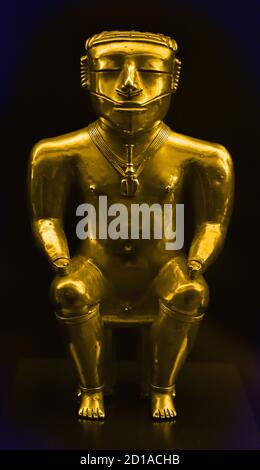 The Quimbaya civilization (cacique) was a Pre-Columbian culture of Colombia, 540 - 640 AD  America, American,  ( noted for their gold work characterized by technical accuracy and detailed designs.) Golden Statuette Stock Photo