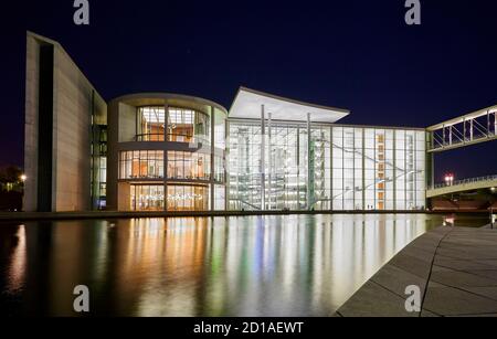 The Paul Lobe Haus (Deutscher Bundestag) next the the river spree during night at the Berlin government district Stock Photo