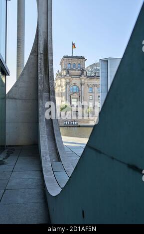 Part of the façade of the Marie Elisabeth Lüders Haus with the Reichstag building next to the river Spree in the background at the Berlin's government Stock Photo