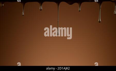 Dripping melted chocolate on soft background, abstract background Stock Photo