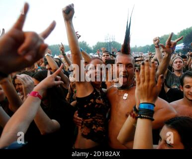 Revellers attend a concert by Hungarian metal band 