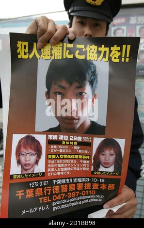 A Police Officer Holds A New Poster Of Tatsuya Ichihashi A Suspect In Last Year S Killing Of Lindsay Hawker A 22 Year Old British Woman Showing Him As He Would Look Disguised As A