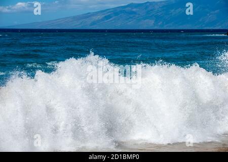 Maui, Hawaii.  Spectacular  wave from the Pacific ocean crashing on the shore. Stock Photo