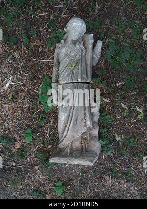 fallen angel    fallen scupture in cemetery Stock Photo