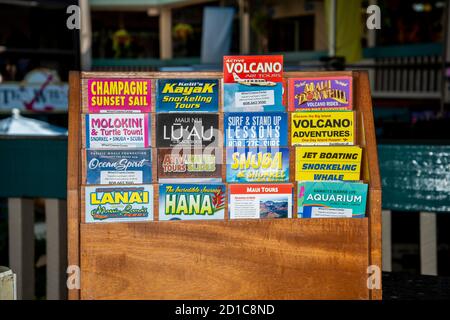Lahaina, Maui, Hawaii. Local shop displays travel brochures and tour guides for the public to look at. Stock Photo