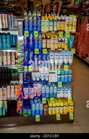 Lahaina, Maui, Hawaii. Local shop displays a colorful rack of suntan lotions for the tourists to buy while on vacation. Stock Photo