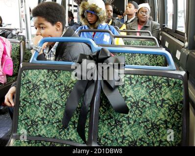 A black ribbon placed on the front seat of a Detroit city bus honors civil rights pioneer Rosa Parks as bus riders leave the seat empty in Detroit, Michigan, October 27, 2005. Buses in Detroit and [Alabama] are honoring Parks by reserving the first seat of their buses as a tribute to her legacy until her funeral next week. Parks, the black woman who refused to yield her seat to a white man in 1955, died on Monday in Detroit at the age of 92. Parks is known as the mother of the modern U.S. civil rights movement.
