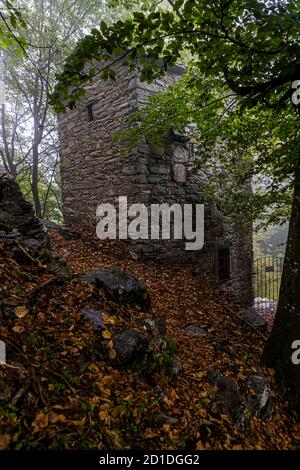 Hidden among the trees, at an altitude of 950 meters stands the Roccolo Meri, the bird tower of Scudellate. The tower has been restored and can also be visited at certain times. Roccolo in Scudelate, Ticino, Switzerland Stock Photo
