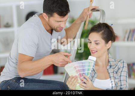 couple choosing from color swatches Stock Photo