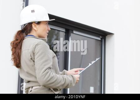 female inspector or engineer checking construction Stock Photo
