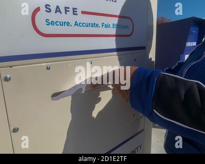 Dayton, OH, USA. 5th Oct, 2020. A voter drops off her election materials in one of OhioÃs secure dropboxes. Credit: Sue Dorfman/ZUMA Wire/Alamy Live News Stock Photo