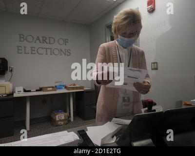 Dayton, OH, USA. 5th Oct, 2020. A Board of Elections worker checks that all of the fields on an absentee ballot request are properly filled out. Credit: Sue Dorfman/ZUMA Wire/Alamy Live News Stock Photo