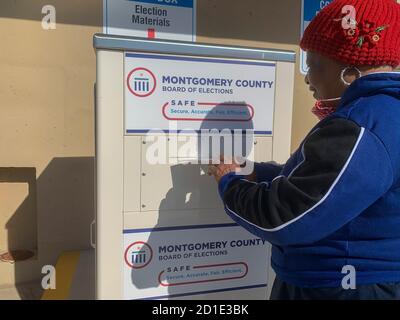 Dayton, OH, USA. 5th Oct, 2020. Addie Burrage drops off her election materials in one of OhioÃs secure vote dropboxes. Credit: Sue Dorfman/ZUMA Wire/Alamy Live News Stock Photo