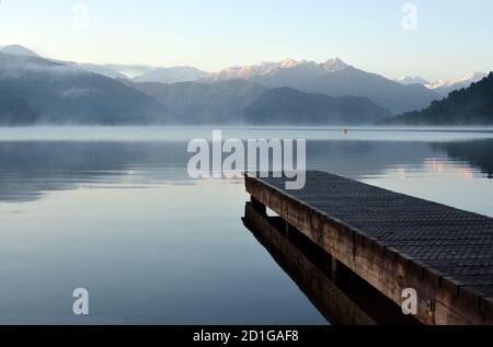 Lake Kaniere and Wooden Jetty at Dawn, Westcoat, New Zealand Stock Photo