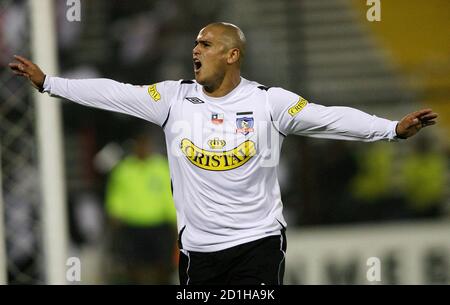 Humberto Suazo C Of Chile S Colo Colo Celebrates With Teammate Rodrigo Millar R And Giovanni Hernandez After Scoring A Goal Against Venezuela S Caracas Fc During Their Copa Libertadores Soccer Match In Santiago