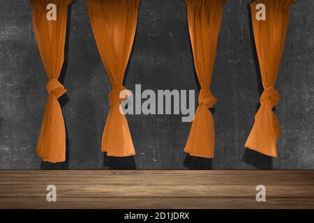 Wooden table with an orange curtain on black wall background Stock Photo