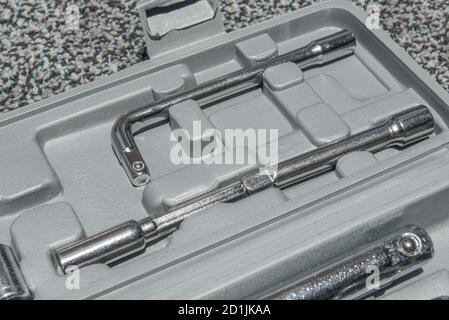 Set of the wrench in the opened toolbox on the carpet Stock Photo