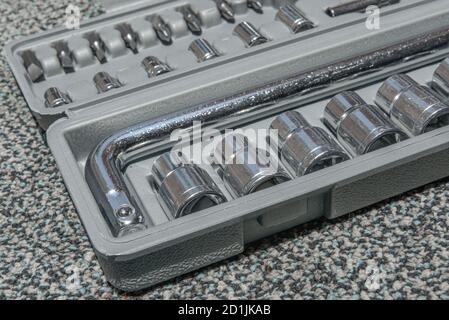 Set of the wrench in the opened toolbox on the carpet Stock Photo