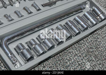 Set of the wrench in the opened toolbox on the carpet Stock Photo