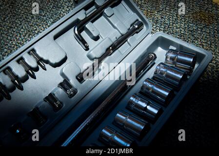 Set of the wrench in the opened toolbox on the carpet Stock Photo