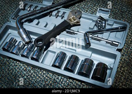 Set of the wrench in the opened toolbox on the carpet Stock Photo